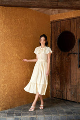 Pleated Silk Midi Dress with Bow-Tie Neckline and Layered Hem for Elegant Occasions